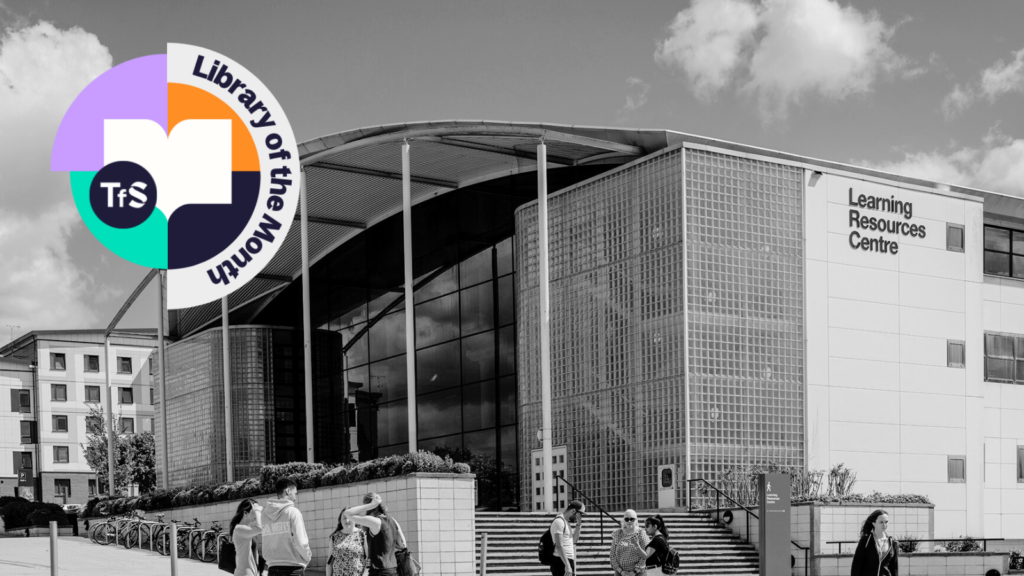 Black and white photo of University of Hertfordshire library with Library of the Month logo in the top left-hand corner